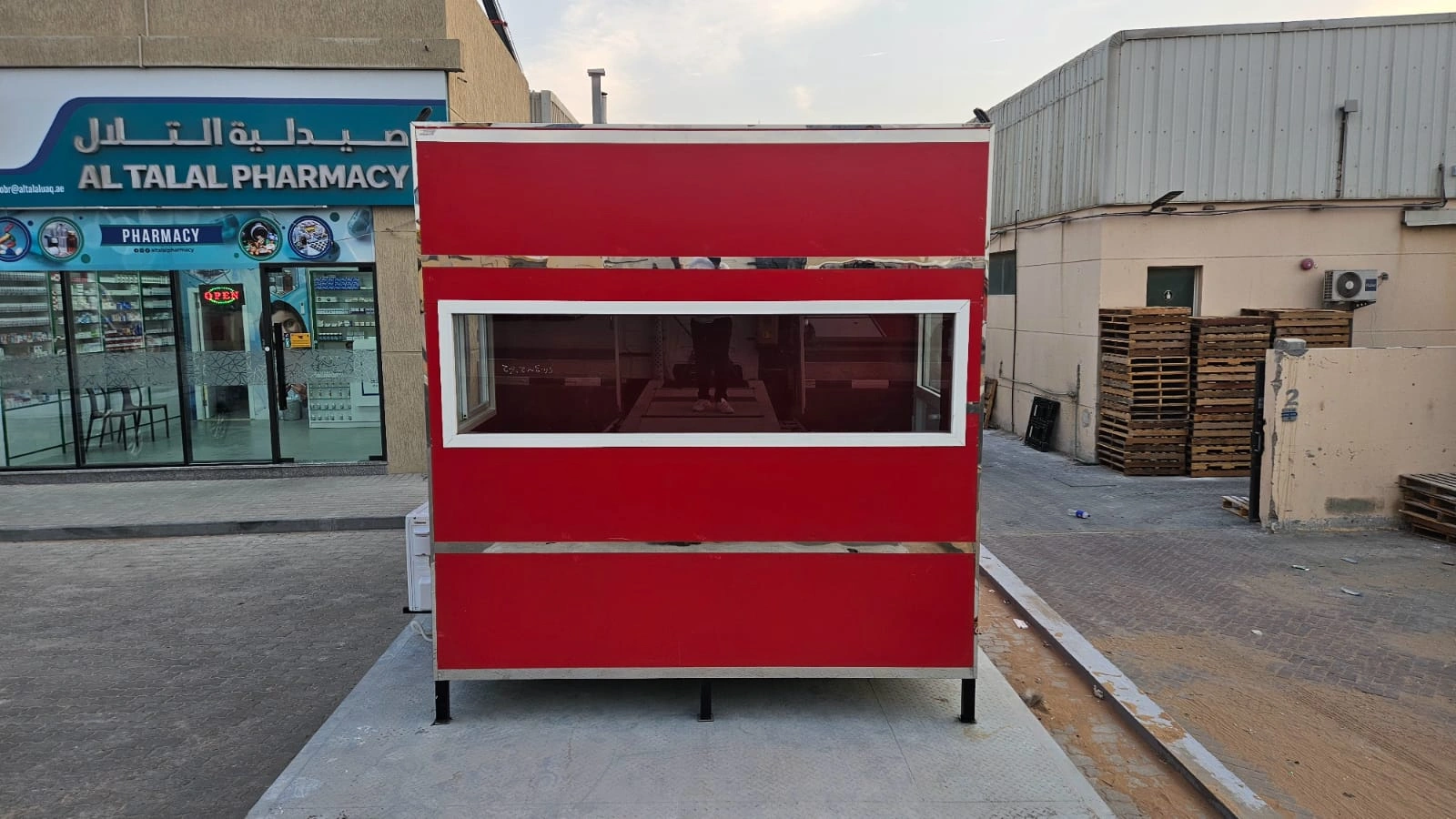 Red mobile site office cabin front view with window and door